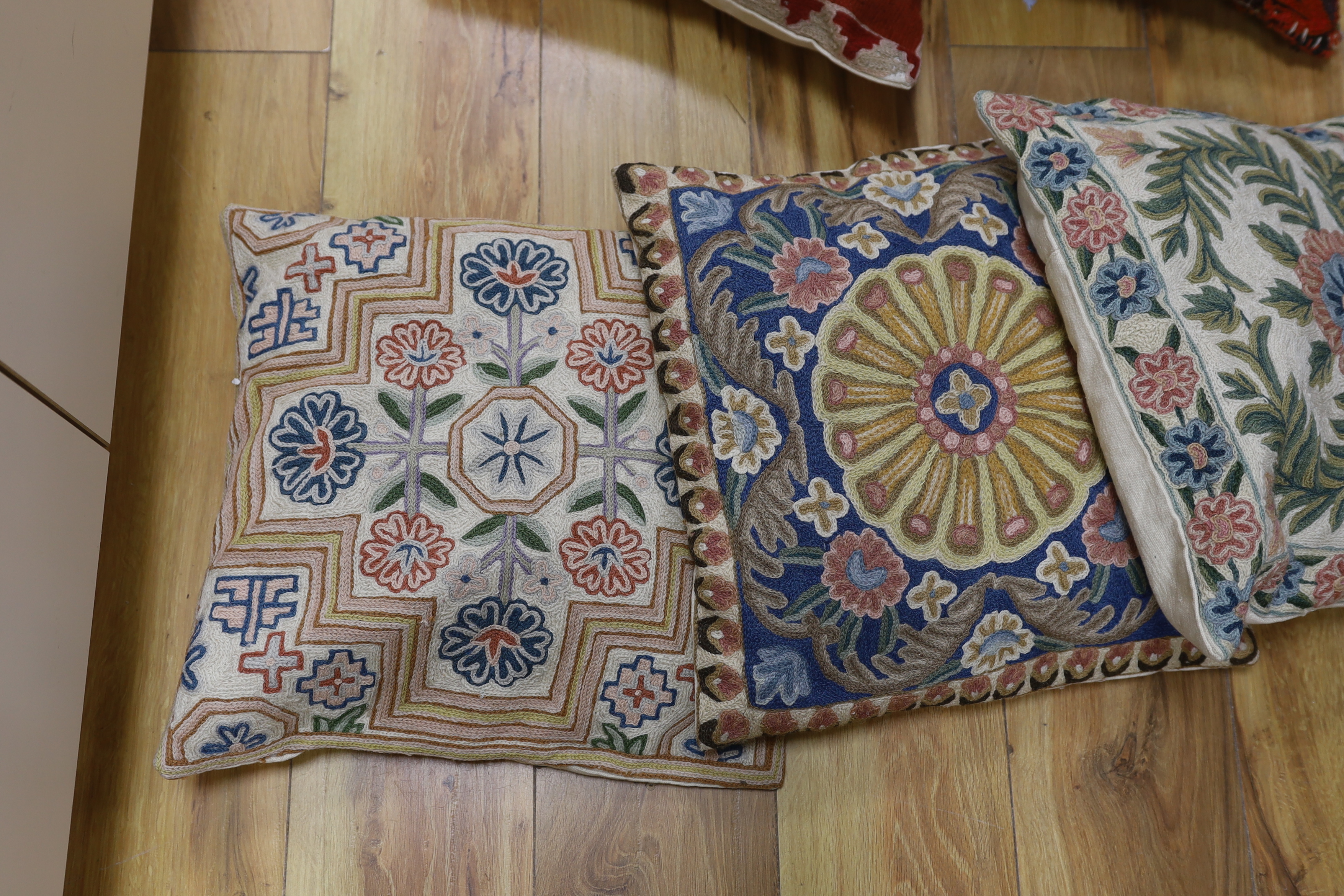 Five wool worked chain stitch cushions, approximately 38cm x 40cm